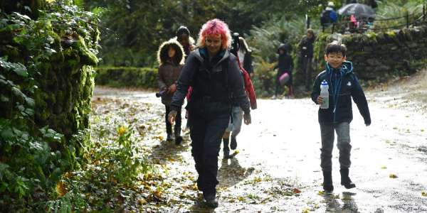Staff member walking with group of children at YHA Langdale